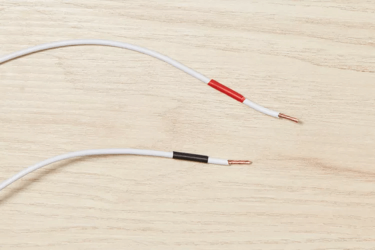 White wires with Red and Black Tape